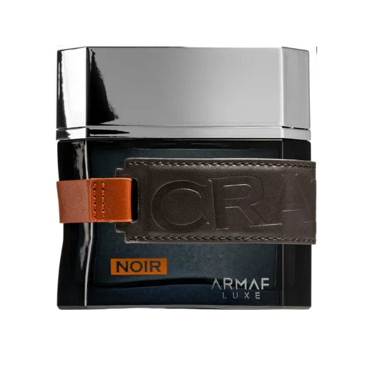 Armaf Luxe Noir perfume bottle with brown leather strap on a white background