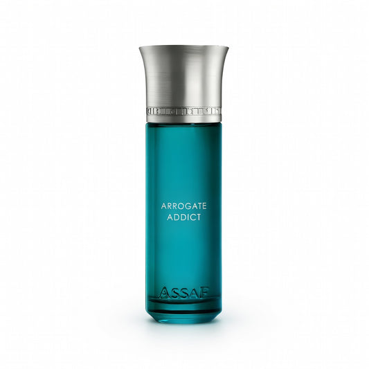 Teal perfume bottle with silver cap on a white background