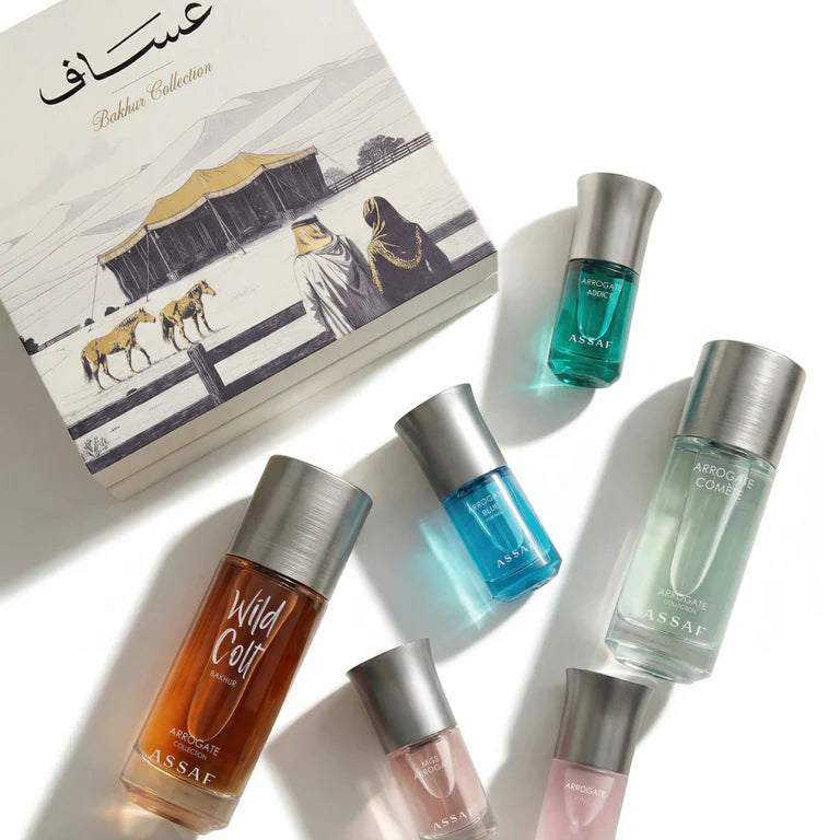 Assaf perfume bottles with a book in the background
