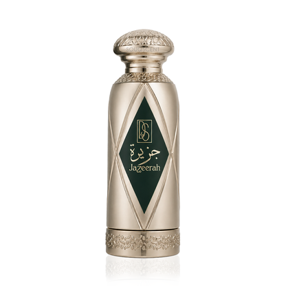 A metallic gold perfume bottle with a dark green diamond-shaped label featuring gold Arabic calligraphy and the English brand name 'Jazeerah'.