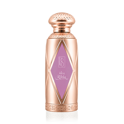 A metallic rose gold cylindrical bottle with a textured cap, featuring a purple diamond-shaped label with the brand name 'Ritha' in Arabic and English script, set against a plain white background.