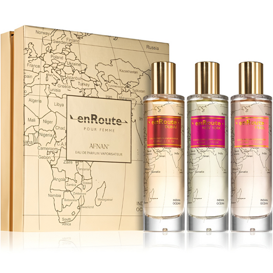 enRoute perfume set with three bottles and a decorative box on a white background