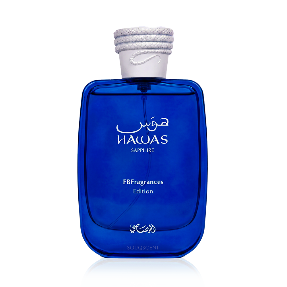 A cobalt blue glass perfume bottle with a white textured cap, labeled 'HAWAS SAPPHIRE' and 'FBFragrances Edition', on a white background.