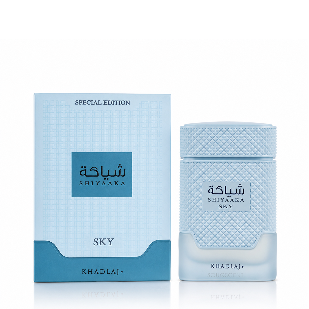 Shiyaaka Sky perfume bottle and its matching light blue packaging box from Khadlaj, featuring a textured pattern and Arabic branding on a white background.