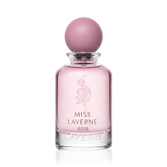 Miss Laverne Rose perfume bottle with a pink spherical cap and pink liquid inside a clear glass bottle, on a white background.