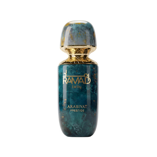 Perfume bottle with gold cap and marbled design on a white background